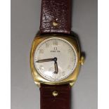 A gentleman's 9ct gold Omega cushion case wrist watch with silvered Arabic dial, monogrammed on