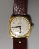 A gentleman's 9ct gold Omega cushion case wrist watch with silvered Arabic dial, monogrammed on