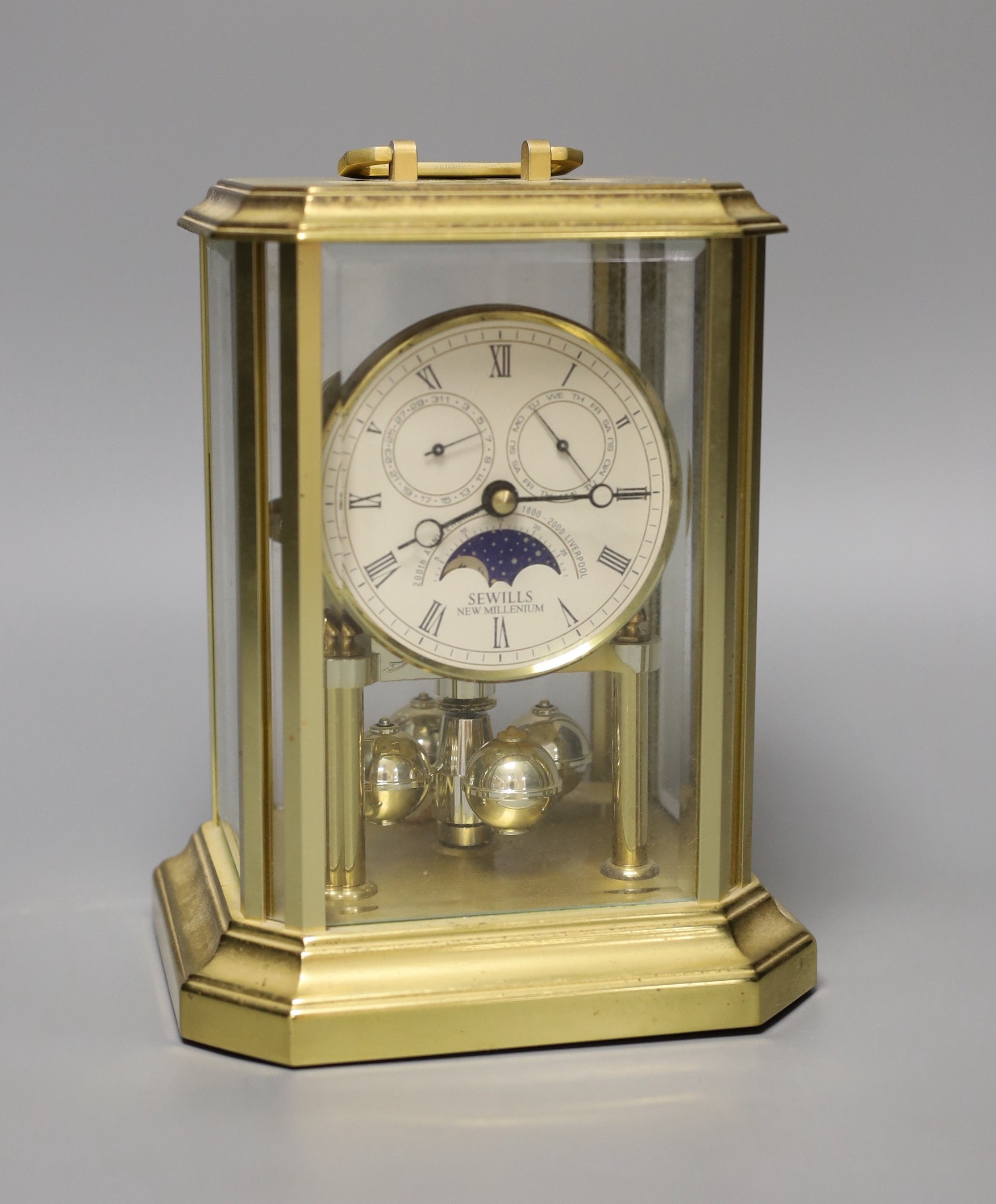 A four glass Sewills 400 day clock, 20cm high.