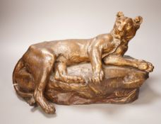 After Charles Valton, a gilt bronze study of a recumbent lioness, 39cm
