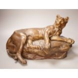 After Charles Valton, a gilt bronze study of a recumbent lioness, 39cm