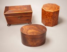An oval mahogany box (with key), an octagonal amboyna tea caddy and a boxwood edged mahogany tea