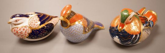 Three Royal Crown Derby Imari paperweights; a duck and two birds, silver badge