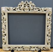 A Carolean style carved wood picture frame, aperture 53 x 63cm