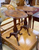A near pair of Victorian marquetry inlaid oval walnut tripod wine tables with open baluster stems,