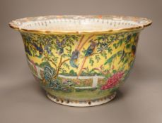 An early 20th century Chinese famille rose yellow ground jardiniere, a.f, 37cm