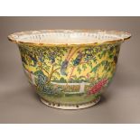 An early 20th century Chinese famille rose yellow ground jardiniere, a.f, 37cm