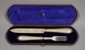 A Victorian cased silver knife and fork serving set, Birmingham 1863, handles loaded