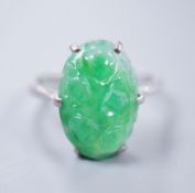 An 18ct white gold and carved jade dress ring, size M, gross 3.9 grams