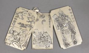 Three Chinese white metal plaques decorated with figures, largest 10cm