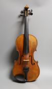 A 19th century violin labelled JB Guadagnini, back measures 35cm, with two bows, one silver-mounted.
