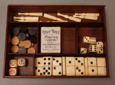 A miniature 19th century games compendium with carved bone playing pieces