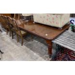 A Victorian mahogany extending dining table on turned legs, length 302cm extended (two spare