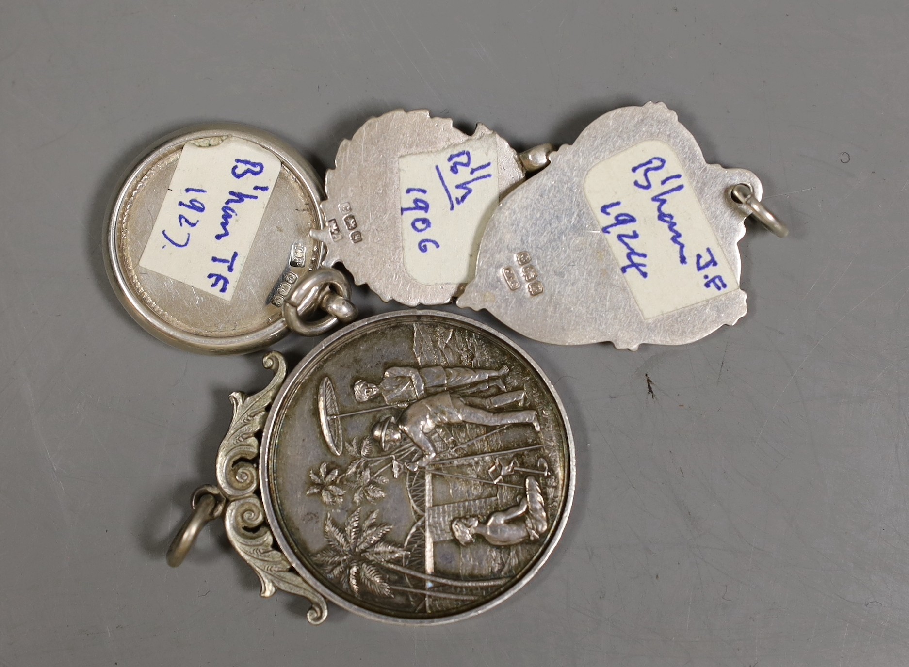 Fifteen assorted silver prize medallions, some with gold overlay, gross 113 grams, and a Madras - Image 2 of 2