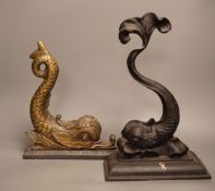 Two cast iron or brass ‘dolphin’ door stops, tallest 38cm