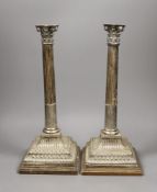 A pair of George II silver corinthian column candlesticks converted to table lamps, London 1759,