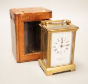 A leather cased brass carriage timepiece, retailed by Bracher & Sydenham