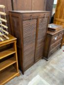 A mid century double fronted tambour shutter filing cabinet, width 89cm, depth 36cm, height 150cm