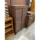 A mid century double fronted tambour shutter filing cabinet, width 89cm, depth 36cm, height 150cm