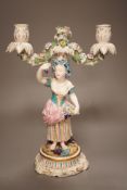 A 19th century English porcelain figural twin branch candelabrum, probably Minton, c.1835, 34cm