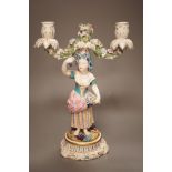 A 19th century English porcelain figural twin branch candelabrum, probably Minton, c.1835, 34cm