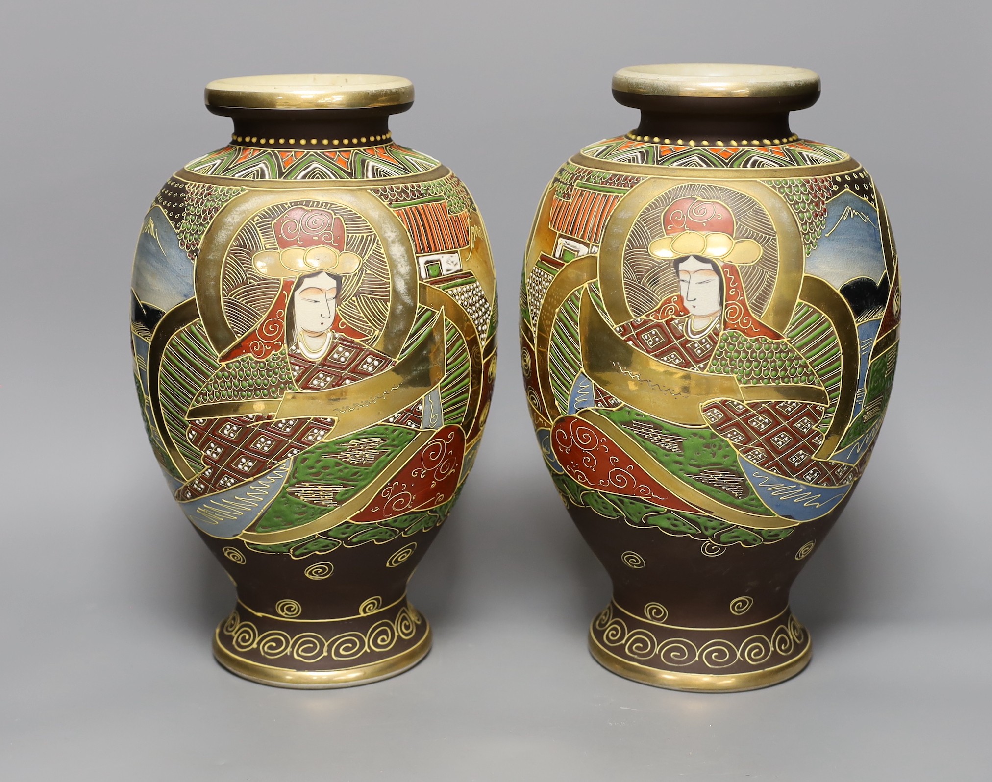 A pair of Satsuma pottery vases, 31cm tall