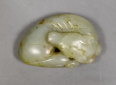 A Chinese jade carving of a sleeping dog, 6cm wide