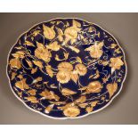 A late 19th century Meissen floral gilt and blue dish, 29cm