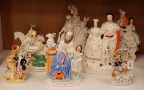 A group of Staffordshire pottery groups, tallest 38cm