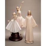A Lladro porcelain group of two ballerinas, "Merry Ballet", number 5035, on a turned wood stand