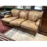 A Howard style pale brown leather three seater settee, length 200cm, width 110cm, height 80cm