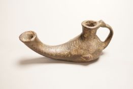An early bronze oil lamp, probably Byzantine, 16cm long