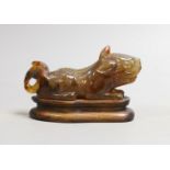 A Chinese agate recumbent lion dog 13cm long