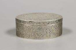 A late 18th century Continental silver snuff box, of oval form, with flower and scroll engraving,