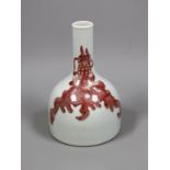 A Chinese underglaze copper red ’dragon’ bottle vase, 18cm tall