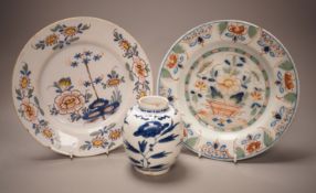 Two 18th century English delftware plates and a 18th century Delft vase, plate diameter 23cm (3)