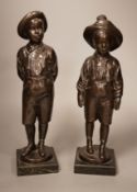 A pair of 20th century patinated metal figures of ruffians, marble bases, tallest 30cm