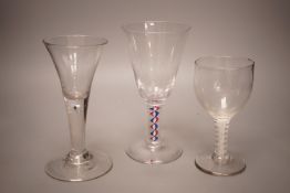 A mid 18th century drawn trumpet ale glass with air tear, a George III d.s.o.t. wine glass (a.f.)