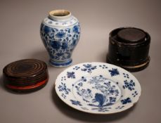 An 18th century Delft blue and white vase, a similar plate and two papier mache boxes, plate