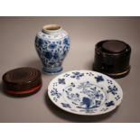 An 18th century Delft blue and white vase, a similar plate and two papier mache boxes, plate