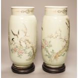 A pair of 19th century Japanese celadon glazed vases (drilled) with hardwood stands, total height