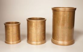 Three early 19th century graduated bronze measures, the larger marked ‘quart Winchester’, the others