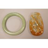 A Chinese jadeite plaque and an aventurine quartz bangle