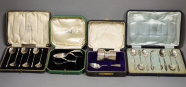 Two cased silver Christening sets, egg cup and spoon and pusher and spoon, a cased set of acanthus