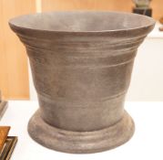 A very large and heavy cast iron mortar, 29cm tall