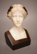 A late 19th/early 20th century French bronze and alabaster bust of a lady, 19cm