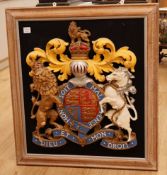 A large carved and painted wall hanging Royal Arms armorial