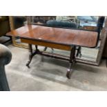A reproduction mahogany drop leaf coffee table, length 112cm extended, width 51cm, height 52cm