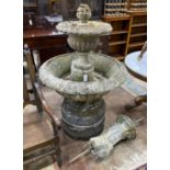 A large circular reconstituted stone garden fountain, diameter approx. 90cm. height 140cm.