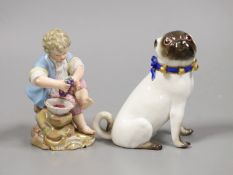 A late 19th century Meissen figure of a pug and a similar seated figure of a boy, tallest 10.5cm